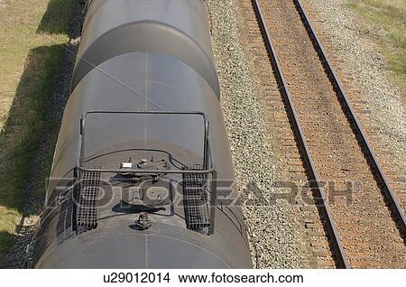 A train along side train tracks View Large Photo Image Picture - A train along side train tracks. Fotosearch