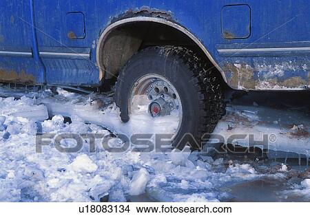 Picture - A truck stuck in the ice. Fotosearch