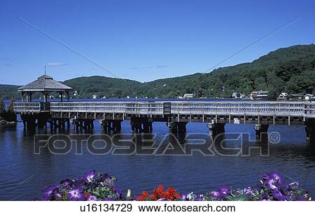 A walking bridge over a body of water View Large Photo Image Stock Photo - A walking bridge over a body of water. Fotosearch