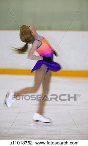 A young figure skater on the ice View Large Photo Image Stock Image - A young figure skater on the ice. Fotosearch