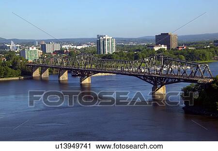 Bridge over river and city landscape View Large Photo Image Stock Image - Bridge over river and city landscape. Fotosearch