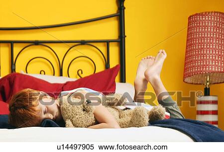 Child hugs teddy bear View Large Photo Image Stock Photography - Child hugs teddy bear. Fotosearch