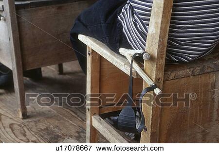 Stock Photo - Child in school with slingshot. Fotosearch