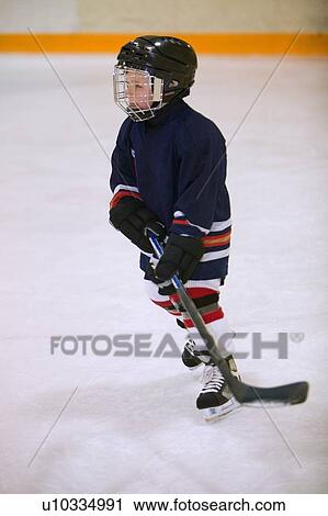 Child playing hockey View Large Photo Image Stock Image - Child playing hockey. Fotosearch
