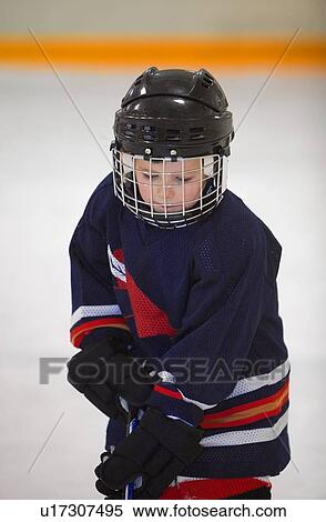Stock Photography - Child playing hockey. Fotosearch