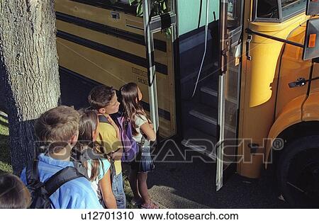 Children loading a school bus View Large Photo Image Stock Image - Children loading a school bus. Fotosearch