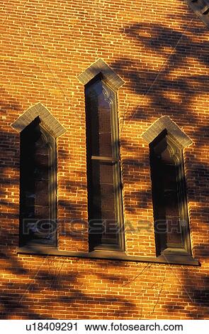 Stock Image - Church windows in a brick wall. Fotosearch
