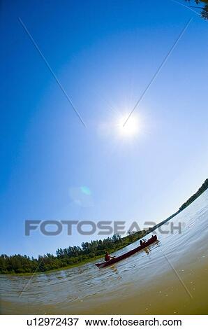 Couple canoeing View Large Photo Image Stock Photo - Couple canoeing. Fotosearch