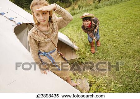 Stock Photography - Cowboy sneaks up on Indian. Fotosearch