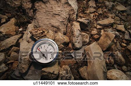 Empty gauge on rocks View Large Photo Image Stock Image - Empty gauge on rocks. Fotosearch