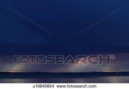 Lightning in sky over water View Large Photo Image Picture - Lightning in sky over water. Fotosearch