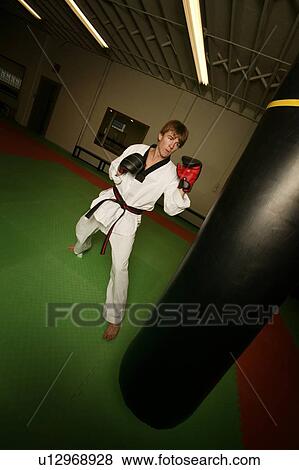 Stock Photo - Man practicing martial arts. Fotosearch