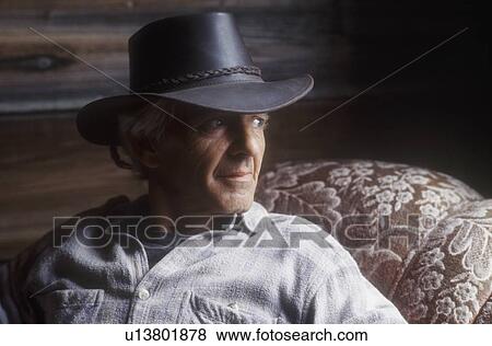 Man with cowboy hat View Large Photo Image Stock Photo - Man with cowboy hat. Fotosearch