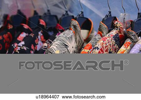 Stock Photo - Oriental silk dresses hanging. Fotosearch