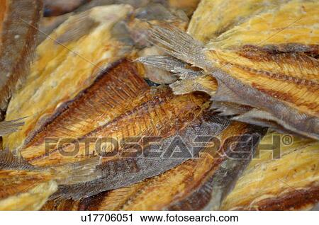 Stock Image - Pile of smoked fish. Fotosearch