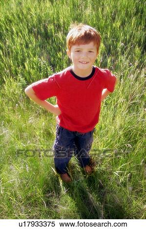 Stock Photography - Portrait of a young boy outside (outdoors). Fotosearch