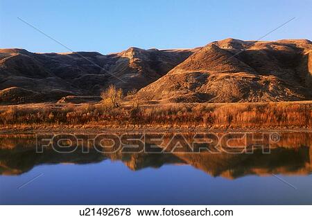 Red rocky earth reflected Red Deer River, Drum Heller, Alberta, Canada View Large Photo Image Stock Photo - Red rocky earth reflected Red Deer River, Drum Heller, Alberta, Canada. Fotosearch