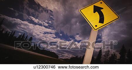 Stock Photograph - Road sign pointing left. Fotosearch