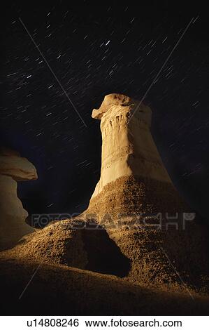 Stock Photograph - Rock formations against the night sky. Fotosearch