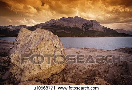 Stock Image - Rocky shore and lake. Fotosearch