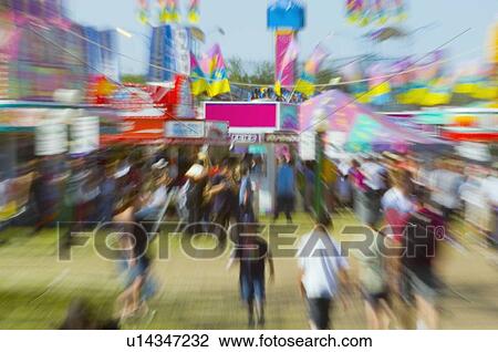 Stock Image - Rushing to the fair. Fotosearch