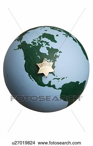 Picture - Sheriff badge on world globe. Fotosearch