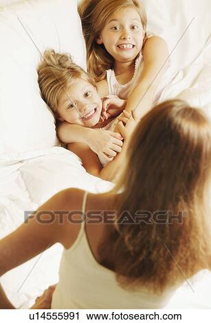 Sisters getting in trouble View Large Photo Image Stock Image - Sisters getting in trouble. Fotosearch