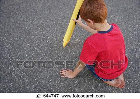 Stock Photo - Small boy with large crayon. Fotosearch
