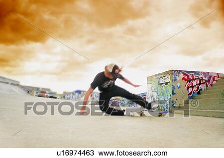 Teenager falling off his skateboard View Large Photo Image Stock Image - Teenager falling off his skateboard. Fotosearch