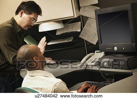 Two co-workers having a discussion View Large Photo Image Stock Image - Two co-workers having a discussion. Fotosearch