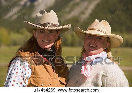 Two women in western wear View Large Photo Image Stock Photo - Two women in western wear. Fotosearch