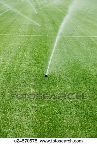 Stock Photo - Underground sprinkler system. Fotosearch