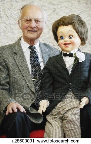 Ventriloquist with puppet View Large Photo Image Stock Image - Ventriloquist with puppet. Fotosearch