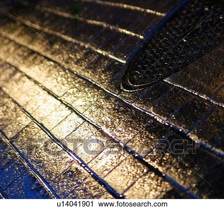Wet road and grid View Large Photo Image Stock Image - Wet road and grid. Fotosearch