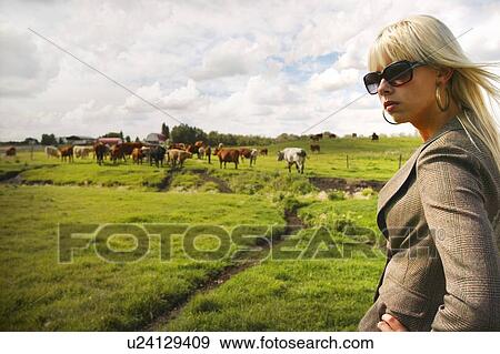 Woman in a field View Large Photo Image Stock Photo - Woman in a field. Fotosearch