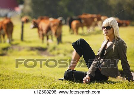 Stock Photograph - Woman on a farm. Fotosearch