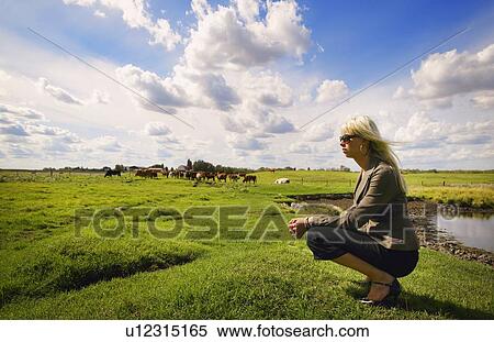 Woman on a farm View Large Photo Image Stock Photography - Woman on a farm. Fotosearch
