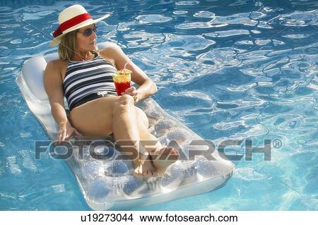 Woman relaxes View Large Photo Image Picture - Woman relaxes. Fotosearch