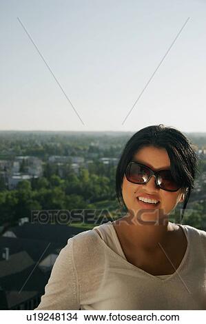 Woman with sunglasses View Large Photo Image Picture - Woman with sunglasses. Fotosearch