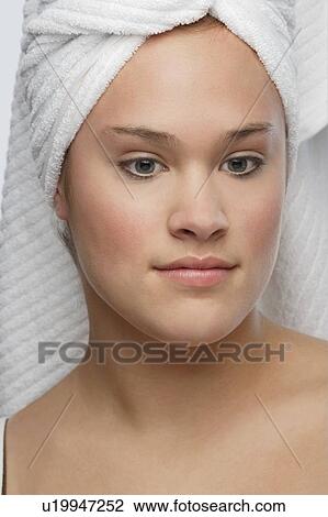 Stock Image - Woman with towel in hair. Fotosearch