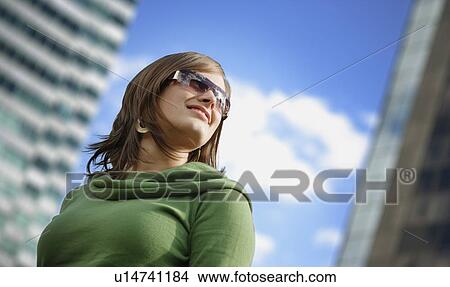 Picture - Woman with trendy sunglasses. Fotosearch