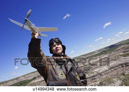 Young child playing with airplane View Large Photo Image Stock Photo - Young child playing with airplane. Fotosearch