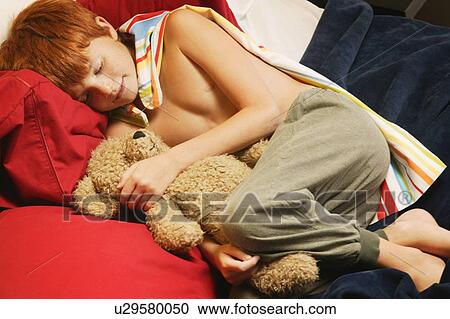 Young super hero sleeping with teddy bear View Large Photo Image Stock Image - Young super hero sleeping with teddy bear. Fotosearch