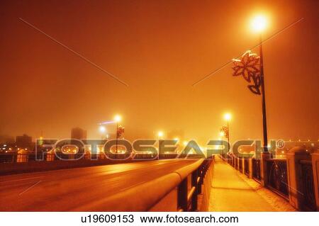 A red haze over a bridge at night View Large Photo Image Stock Image - A red haze over a bridge at night. Fotosearch
