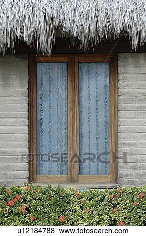 Stock Photo - A window in a hut. Fotosearch