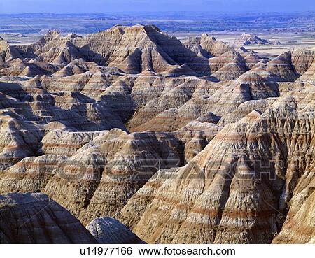 Stock Photograph - Banded colors in eroded landscape, Badlands National Park. Fotosearch