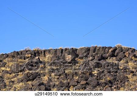 Basalt lava rock escarpment View Large Photo Image Stock Image - Basalt lava rock escarpment. Fotosearch