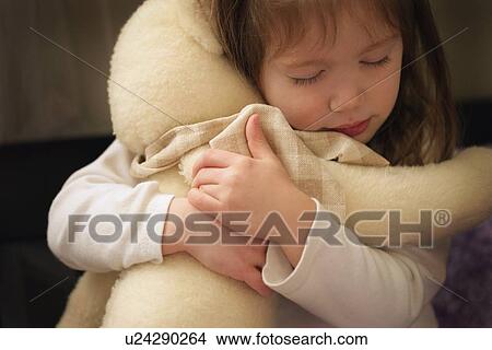 Child hugs bear View Large Photo Image Picture - Child hugs bear. Fotosearch
