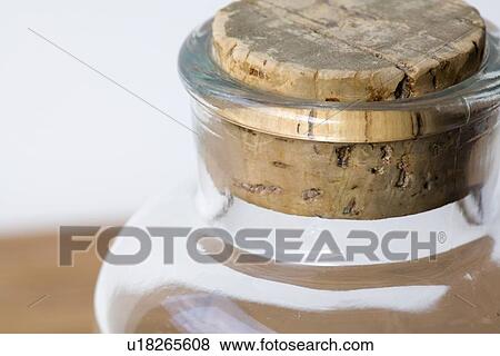 Clear glass jar with cork stopper View Large Photo Image Stock Photo - Clear glass jar with cork stopper . Fotosearch