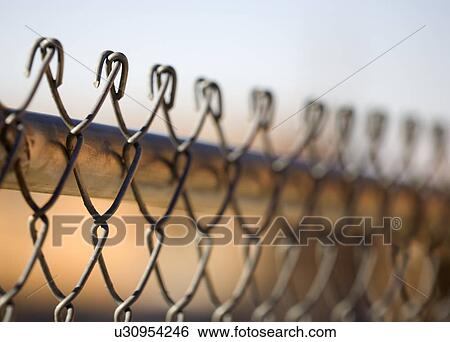 Close-up of chain link fence View Large Photo Image Stock Photograph - Close-up of chain link fence. Fotosearch